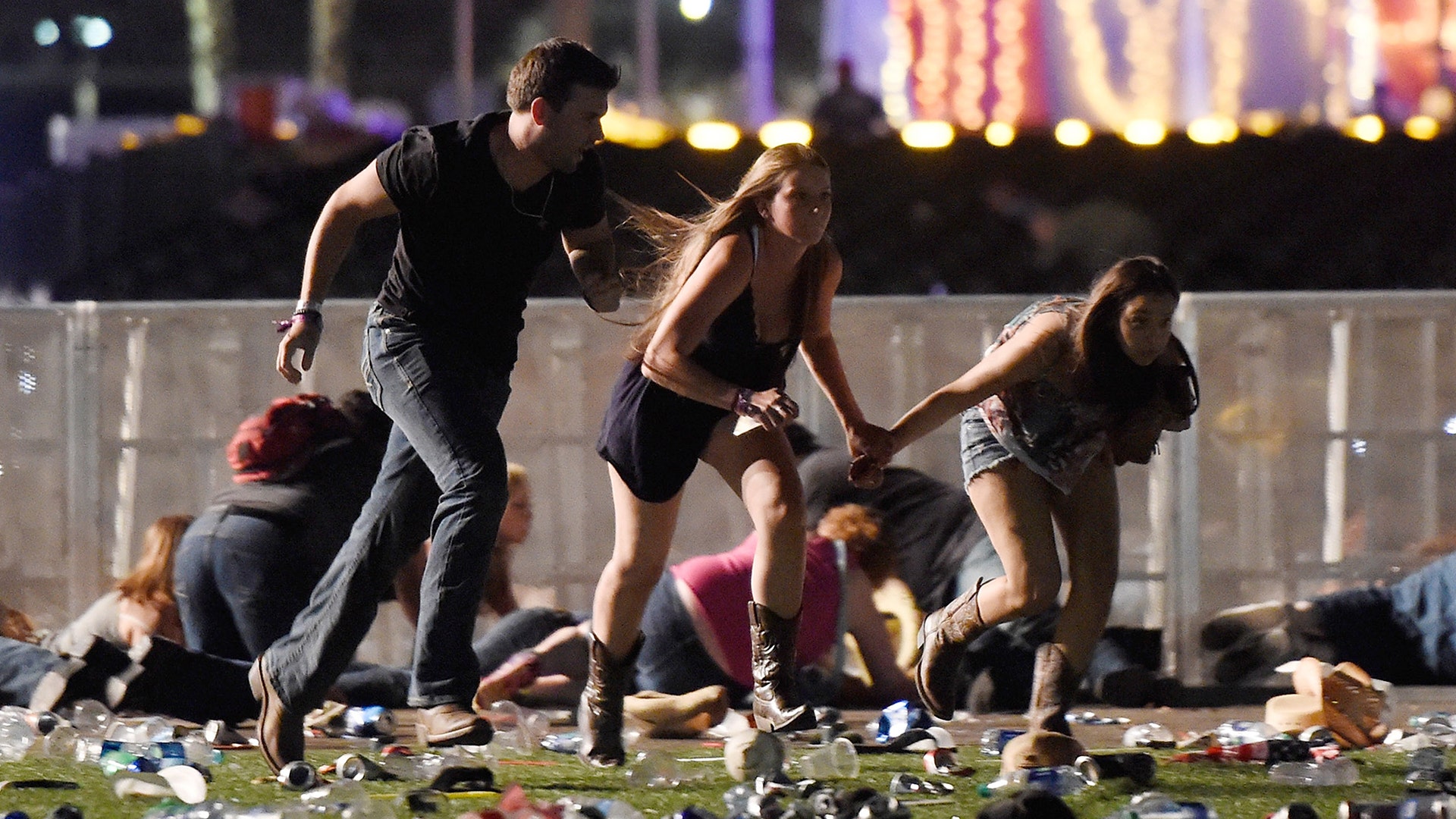 People run from the Route 91 Harvest country music festival after a gunman opened fire in Las Vegas, Nevada, October 1