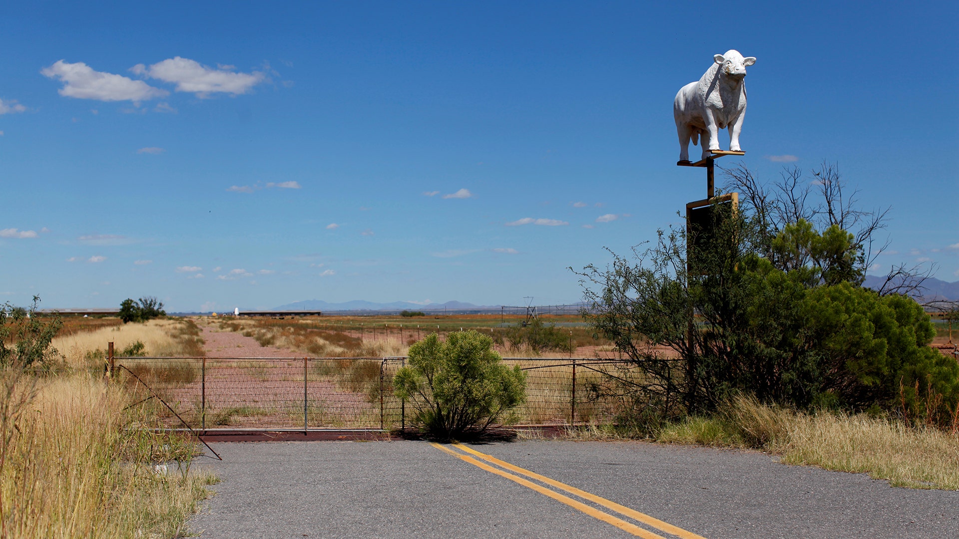 A road abruptly ends next to a sign for a cattle ranch near Douglas, Arizona, United States.