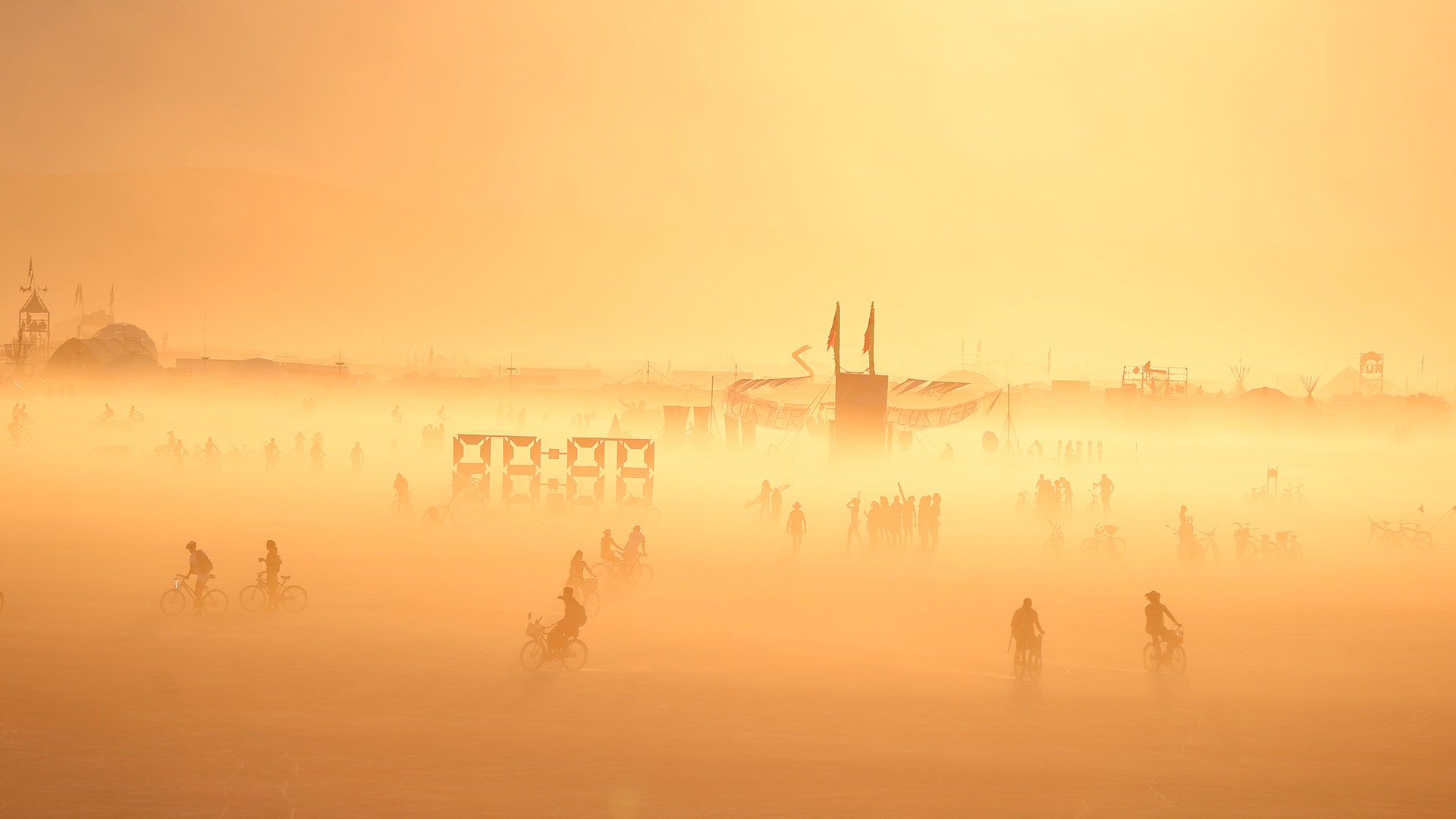 The sun sets on the playa at the annual Burning Man arts and music festival in the Black Rock Desert of Nevada, September 1