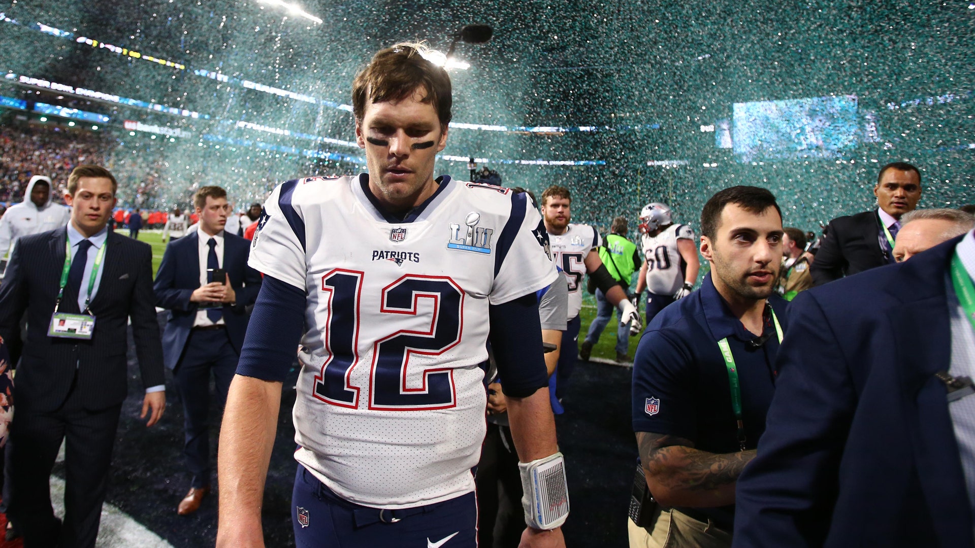 New England Patriots quarterback Tom Brady walks off the field after losing Super Bowl 52 to the Philadelphia Eagles