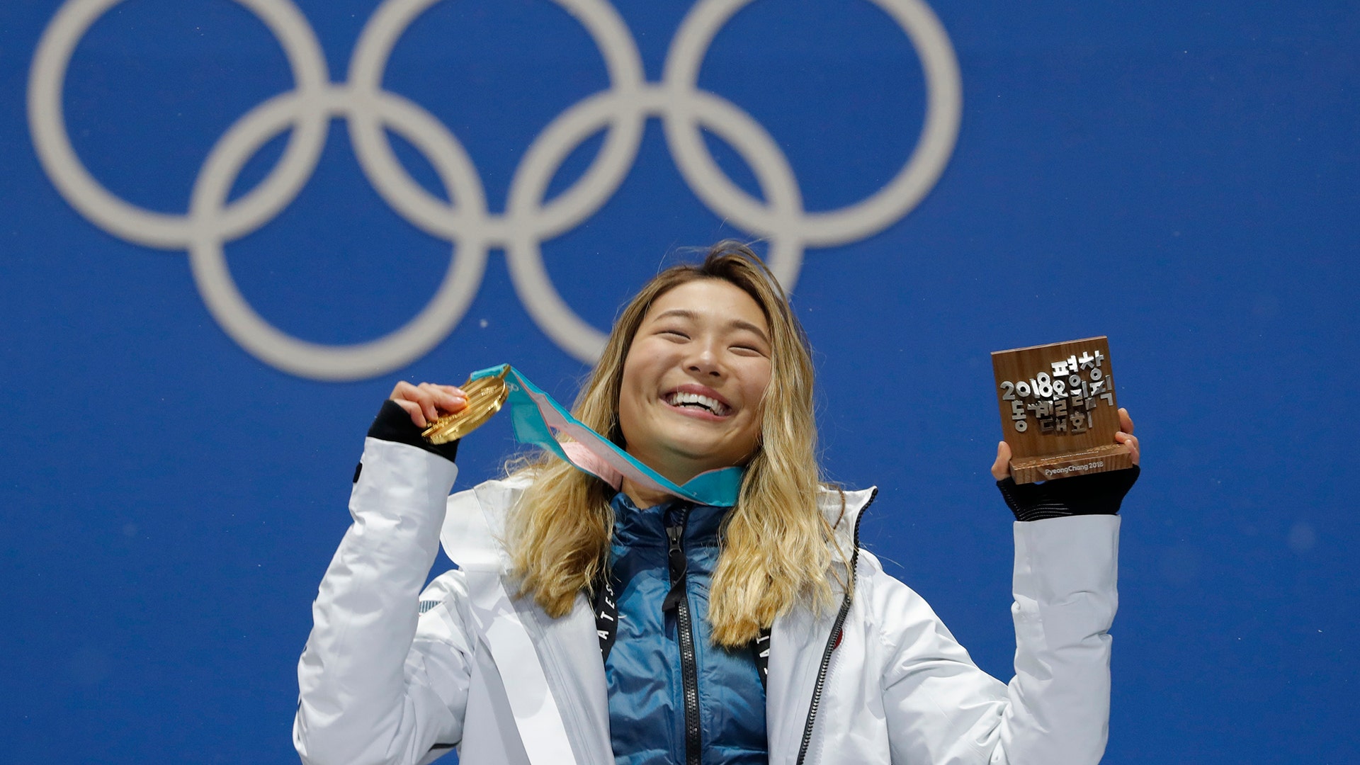 Chloe Kim of the United States with her gold medal after winning the women's halfpipe at the 2018 Winter Olympics in Pyeongchang