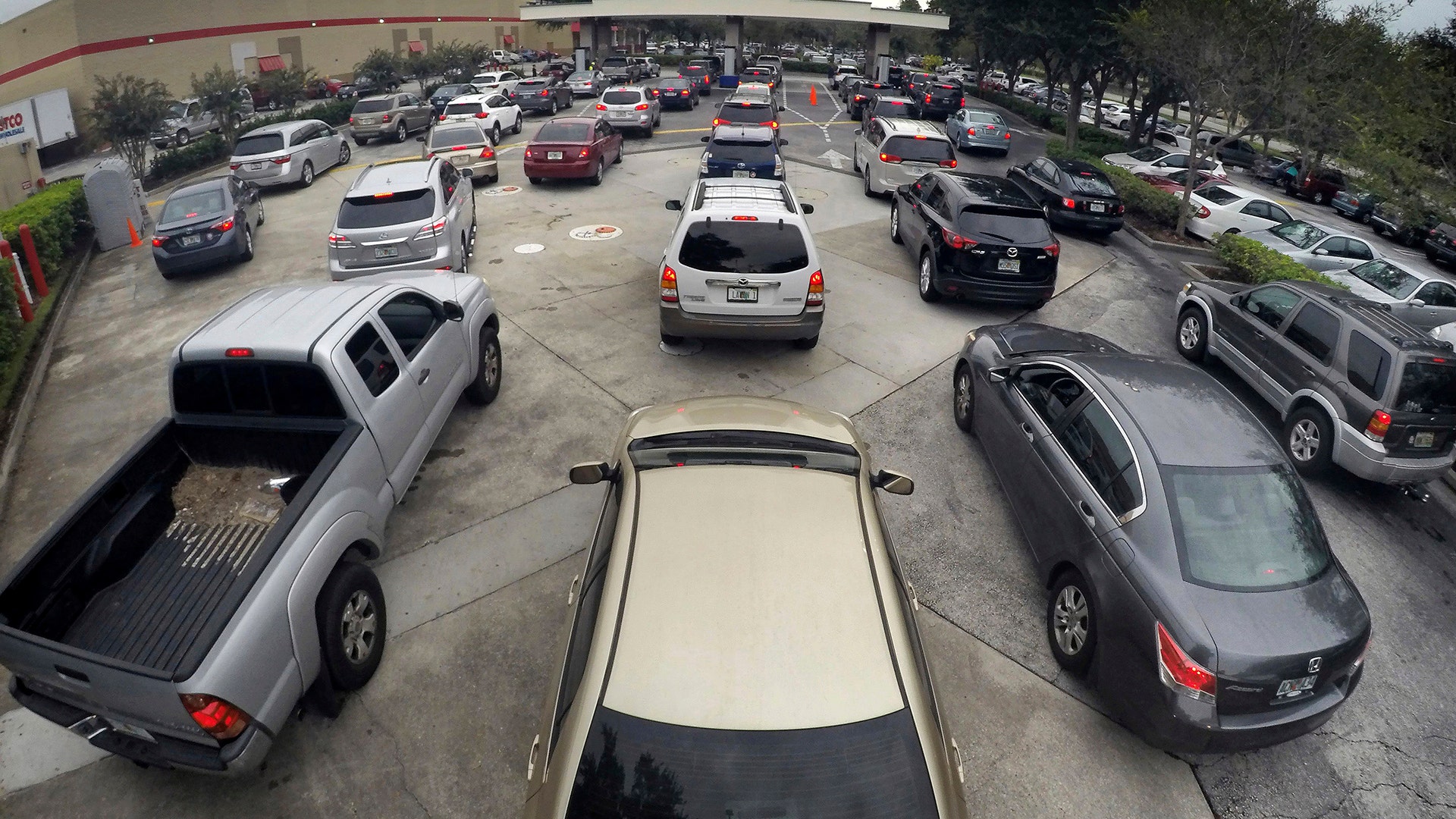 Drivers wait in line for gasoline in Altamonte Springs, Fla., ahead of the anticipated arrival of Hurricane Irma, Wednesday