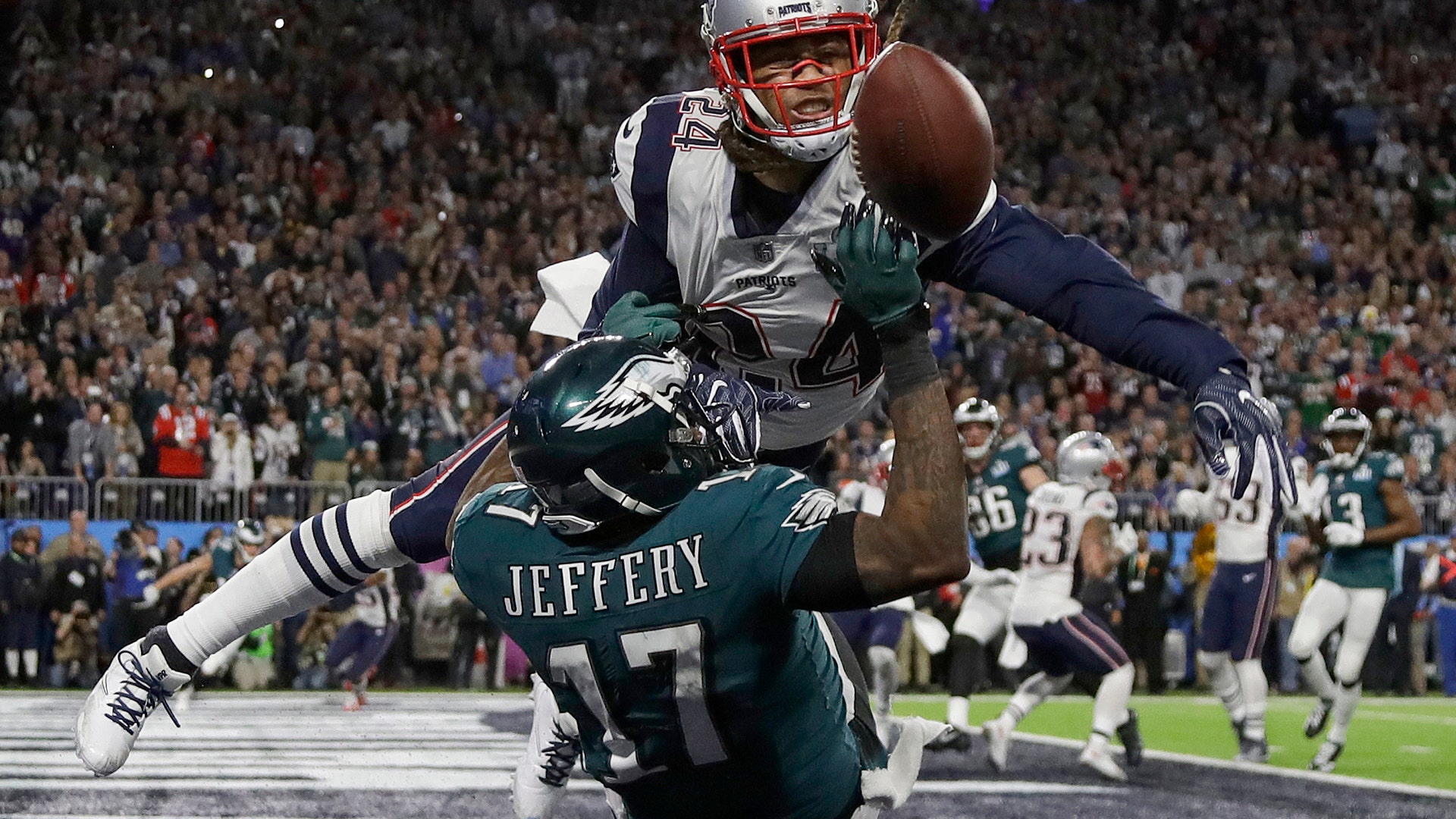 New England Patriots' Stephon Gilmore breaks up a pass for Philadelphia Eagles' Alshon Jeffery during the first half of Super Bowl 52