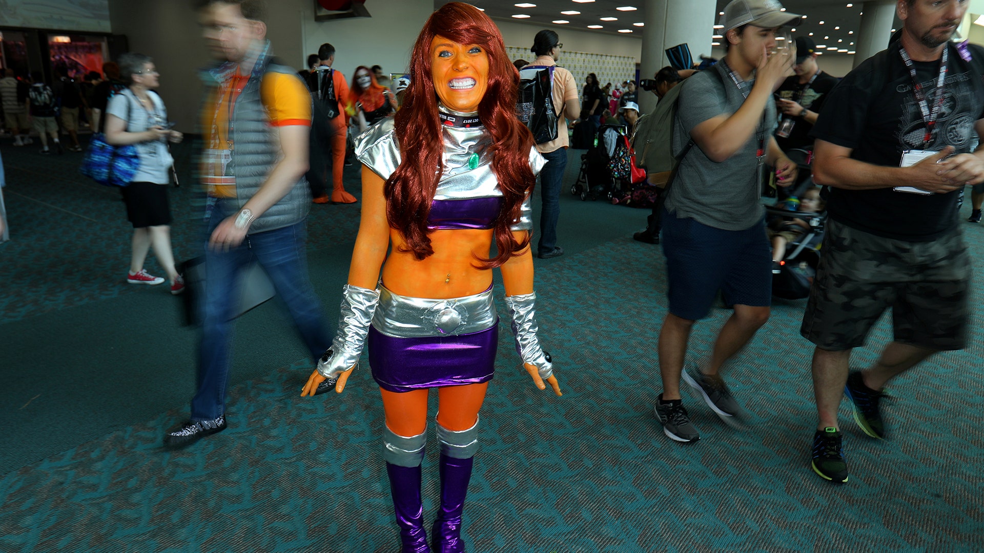An attendee poses for a picture as she arrives at Comic-Con International in San Diego