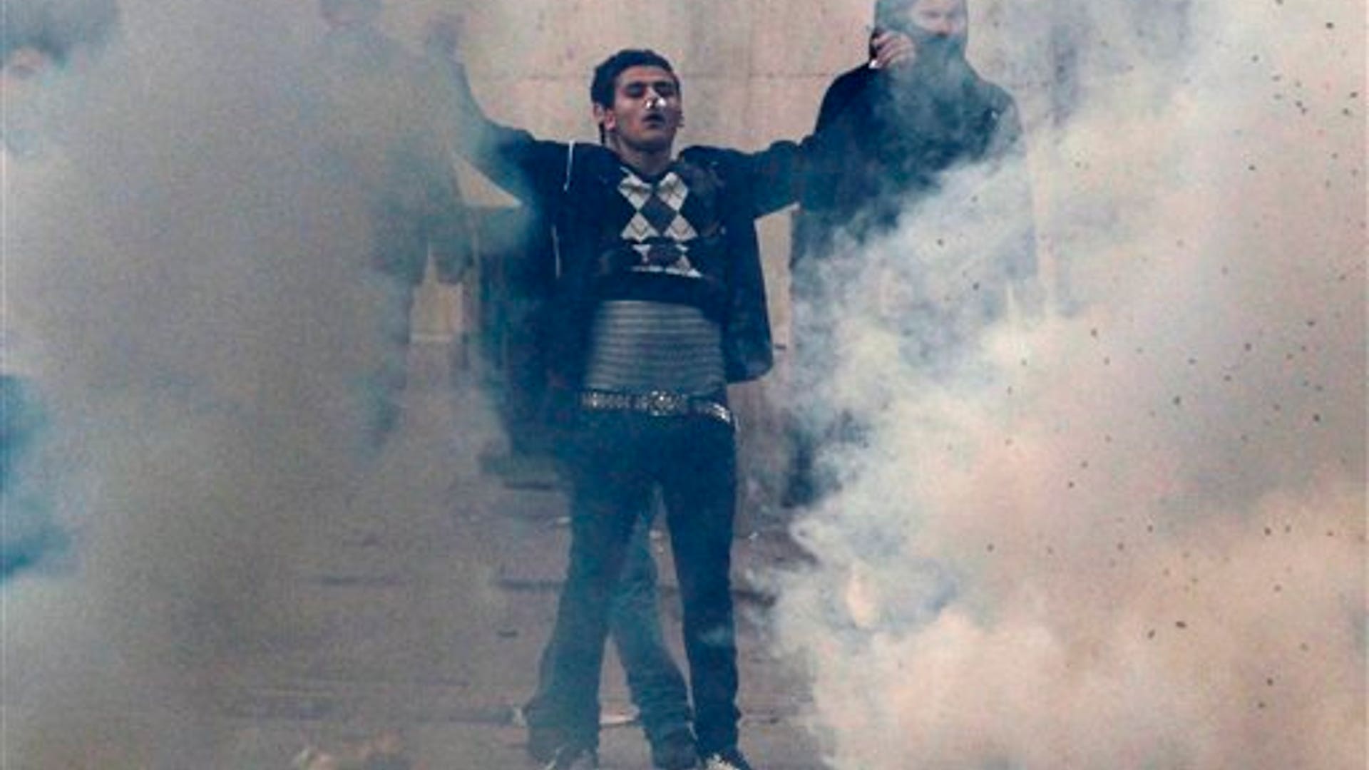 A_demonstrators_faces_police_during_clashes
