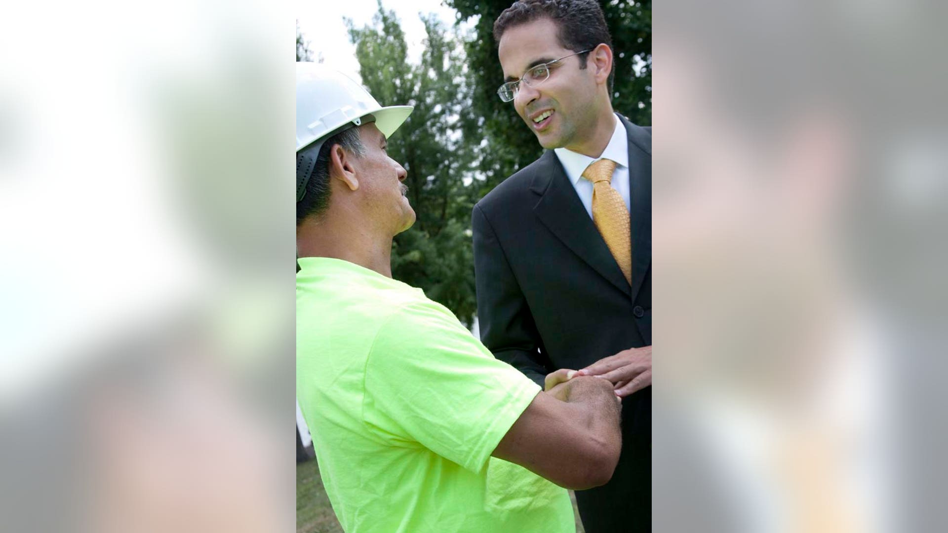 Angel Taveras Shaking Hands