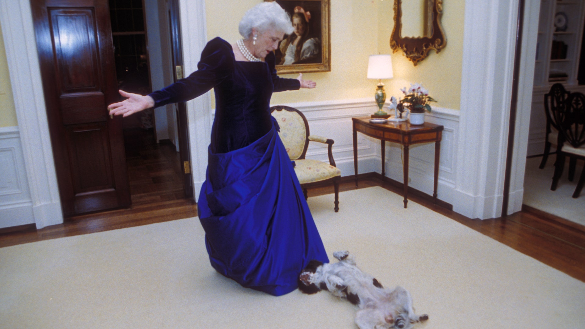 Barbara Bush upstairs in the residence of the White House with First Dog Millie preparing to attend the inagural ball