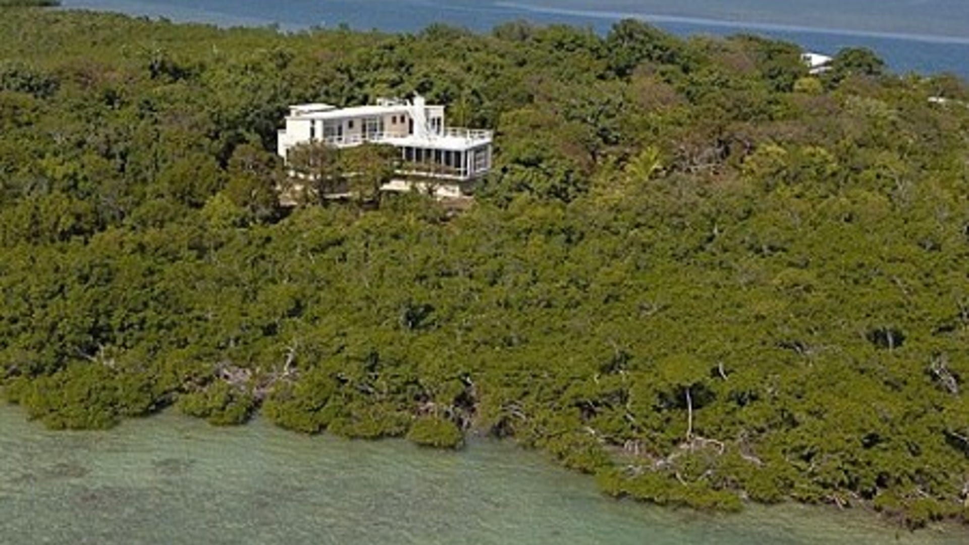 Broad Key, Key Largo FL. For Sale: $20,000,000. If the home is connected to land by a 180-foot-long bridge, is it still considered an island? Although this home doesn’t require a boat ride arrival, the wooden walkway is the only thing linking the home to the mainland. The 1,250-square-foot main house was built in 2000 and includes vaulted ceilings, wood flooring and a covered in-deck hot tub. An additional home, built in 1950, has been completely updated and has five bedrooms, three bathrooms and a custom kitchen with high-end appliances.
