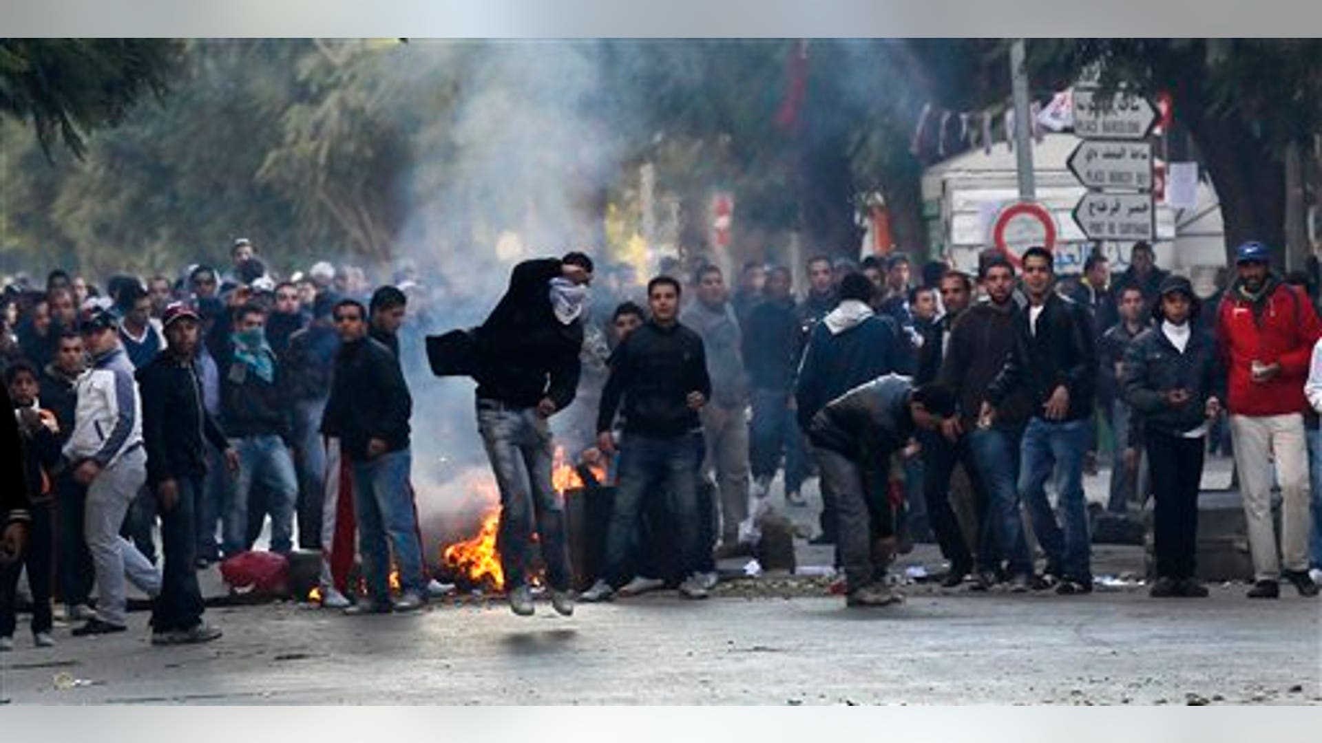 Demontrators_throw_rocks_towards_police