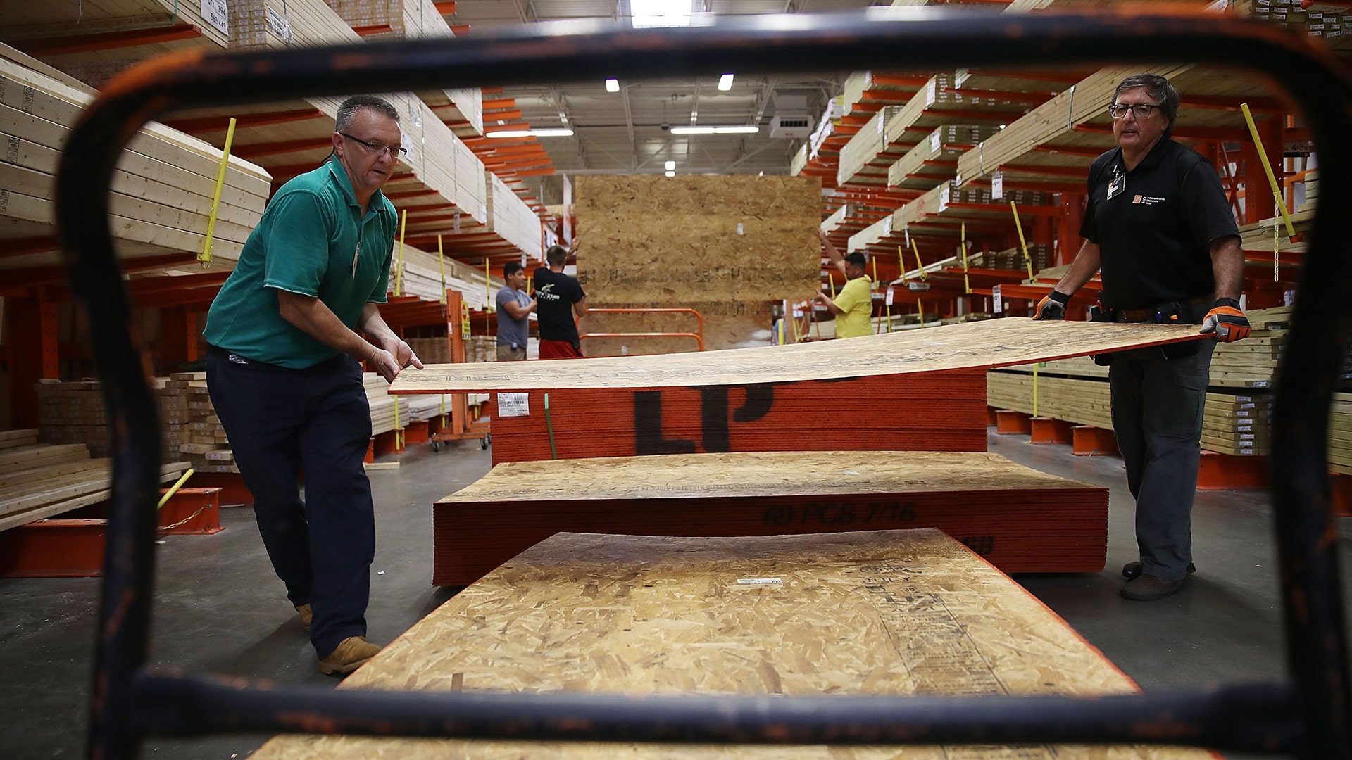 Home Depot employees load plywood ahead of the arrival of Hurricane Florence in Myrtle Beach, South Carolina, Tuesday