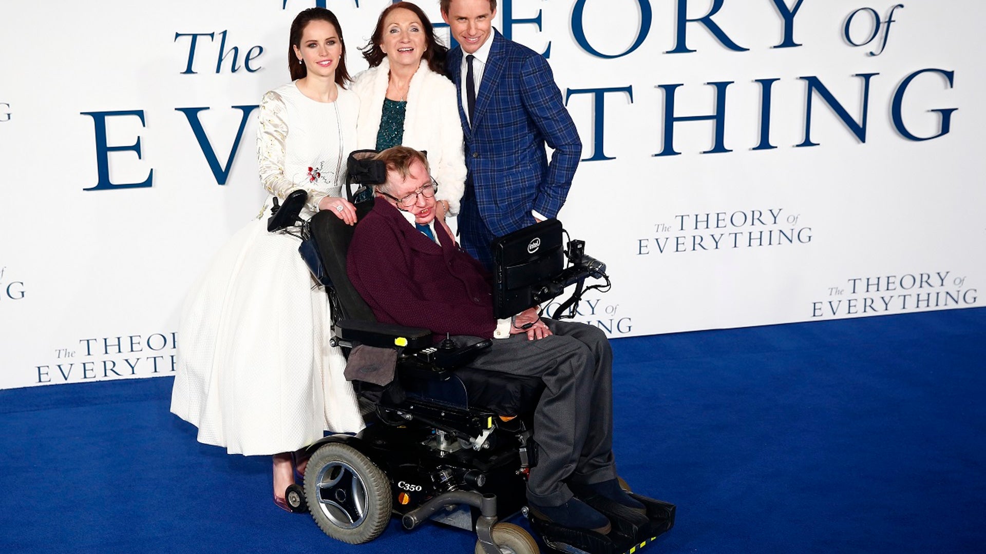 Stephen hawking poses with his ex-wife Jane Wilde Hawking (C) and the stars of “The Theory of Everything” movie that was based on his life.