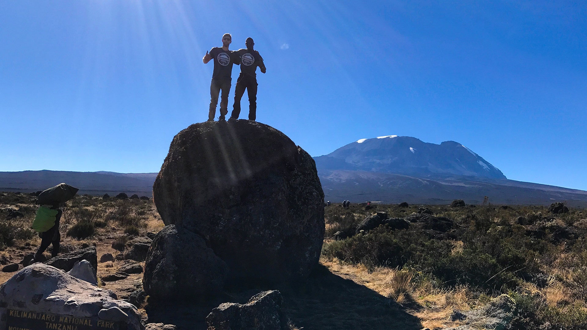 Jake Rath, left, and Marine veteran Cpl. Kionte Story on their hike up Mount Kilimanjaro.