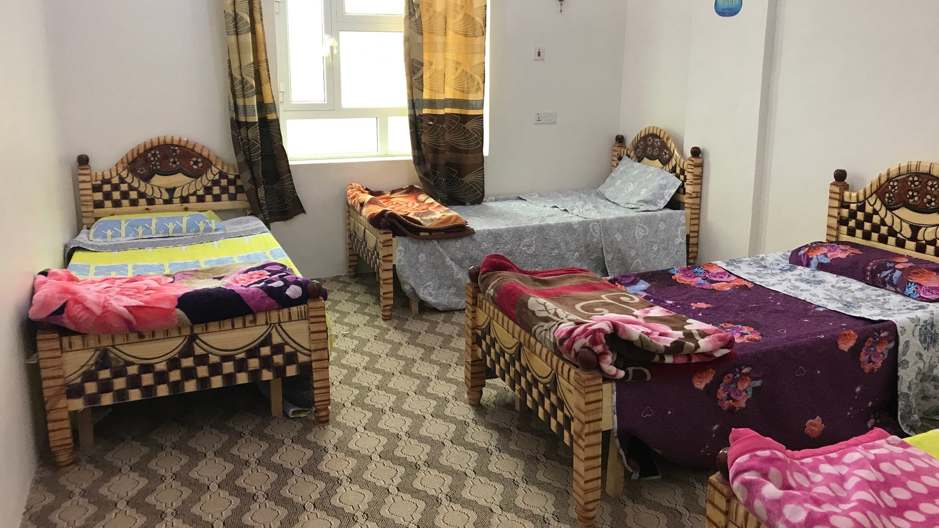 Students share a clean, dormitory-style bedroom during their time at the KS Relief Center.