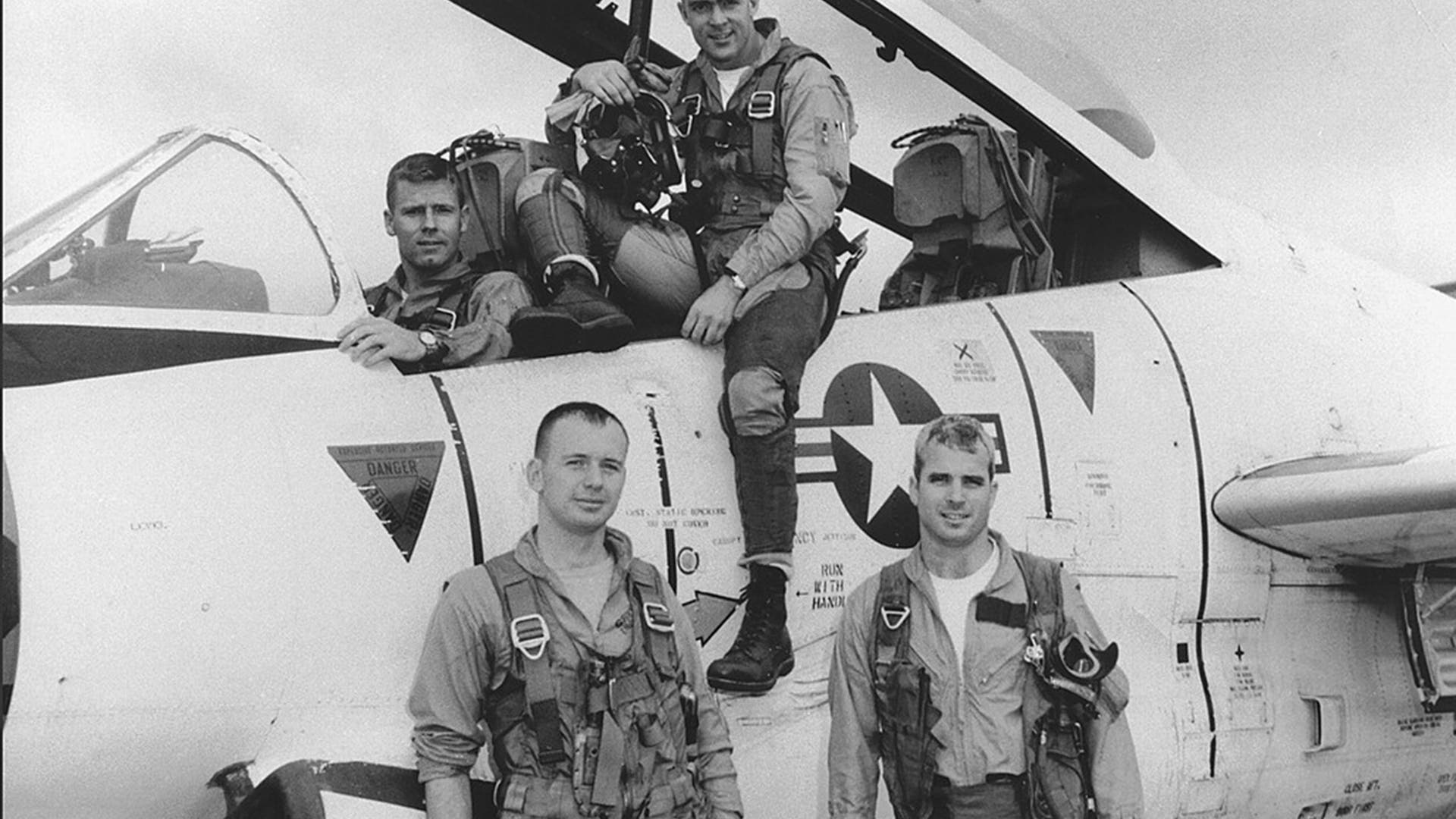 John McCain (Bottom R) poses with his U.S. Navy squadron in 1965.  