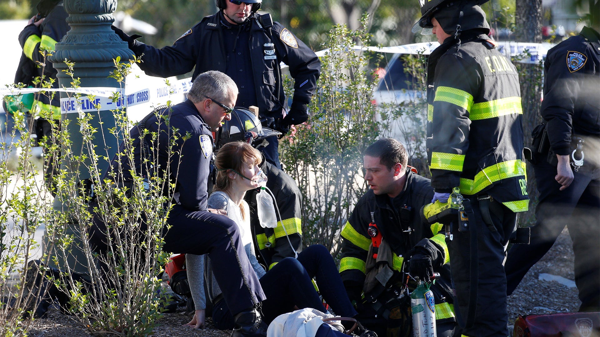 A woman is aided by first responders after a terror attack on a bike path in New York City, October 31