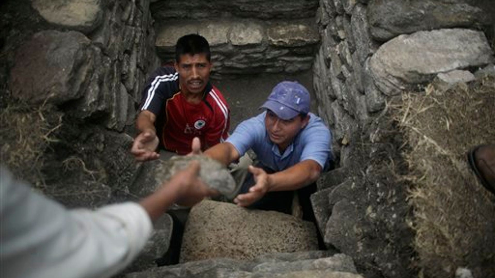 Archaeologists Clear Stones