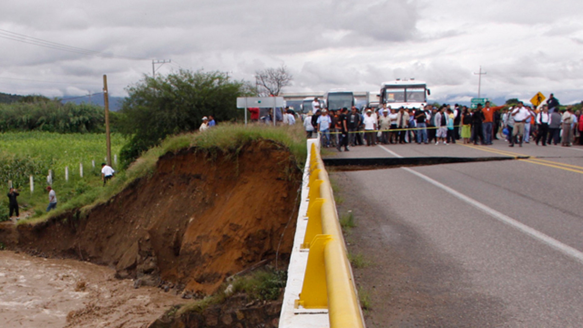Crowd Gathers Around Damage