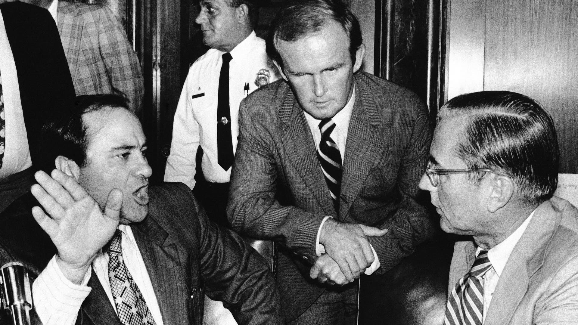 Central Intelligence Agency Director William E. Colby with Sen. James Abourzek and Rep. Michael J. Harrington