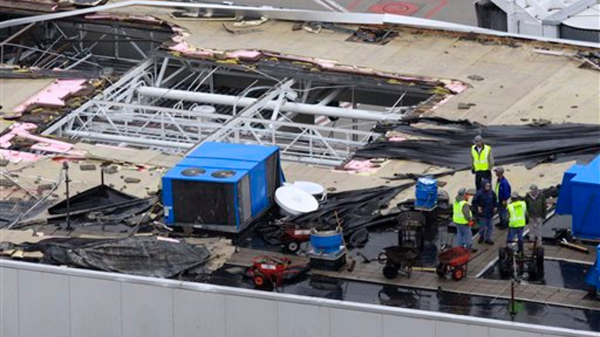 large hole is seen in the roof of Concourse C at Lambert-St. Louis International Airport