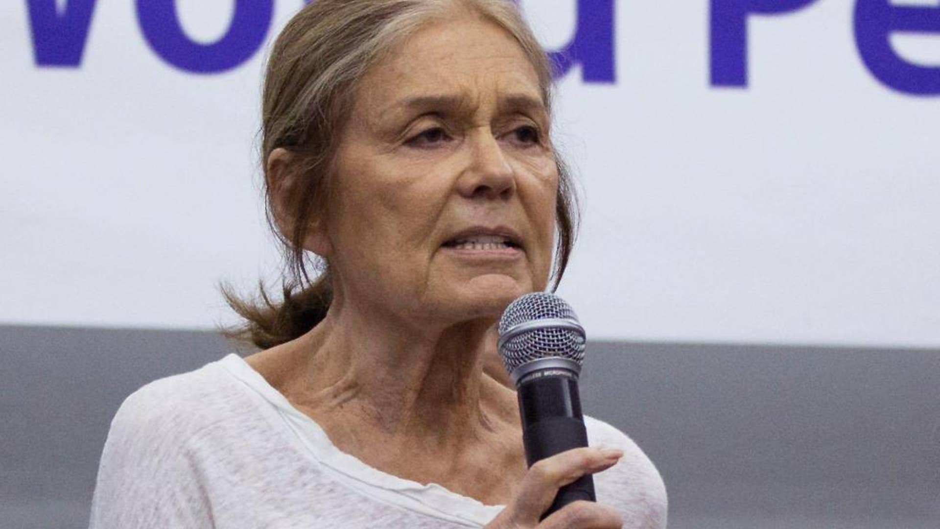 FILE - In this May 19, 2015 file photo, U.S. activist Gloria Steinem speaks among the members of the Women Cross DMZ group during a press conference before they leave for Pyongyang, at a hotel in Beijing, China. Steinem and a group of 29 other women from 15 countries are set to walk across the Demilitarized Zone dividing North and South Korea on Sunday, May 24 after obtaining a rare green light from both governments. (AP Photo/Andy Wong, File)