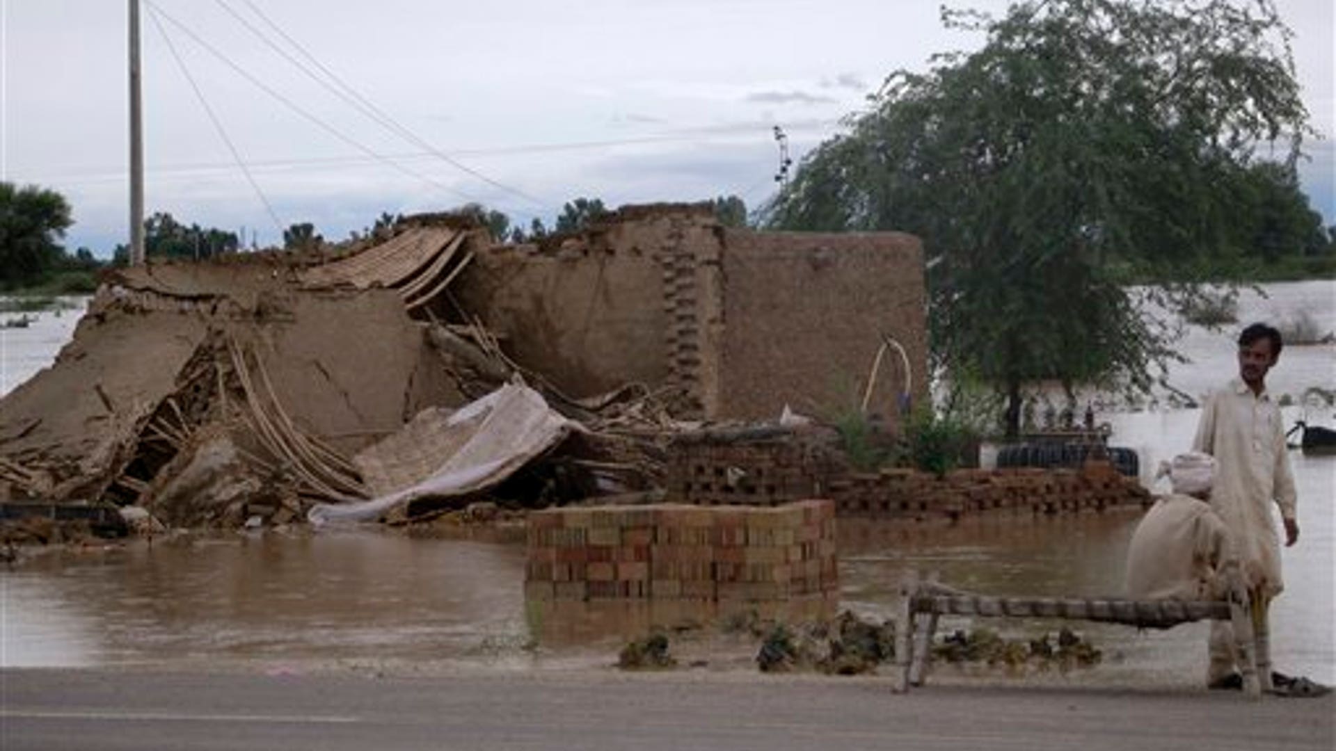 Villagers Gather by Collapsed House
