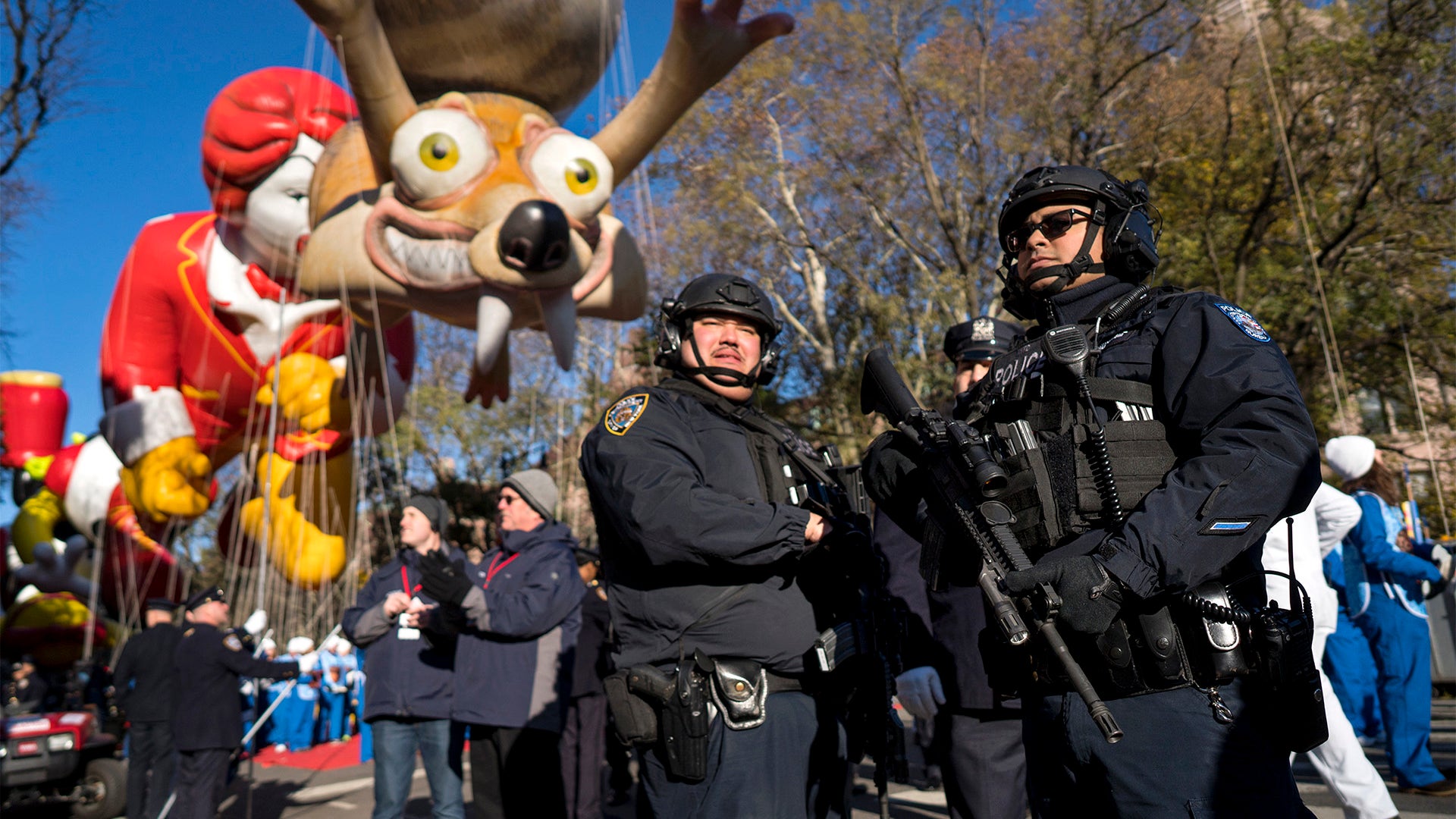 Heavily-armed members of the NYPD take a position along the route before the start of the Thanksgiving Day Parade