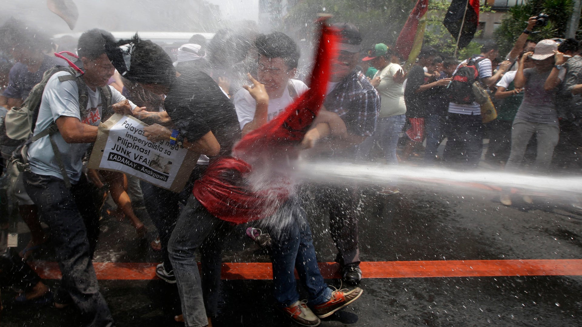Activists protest President obama visit 
