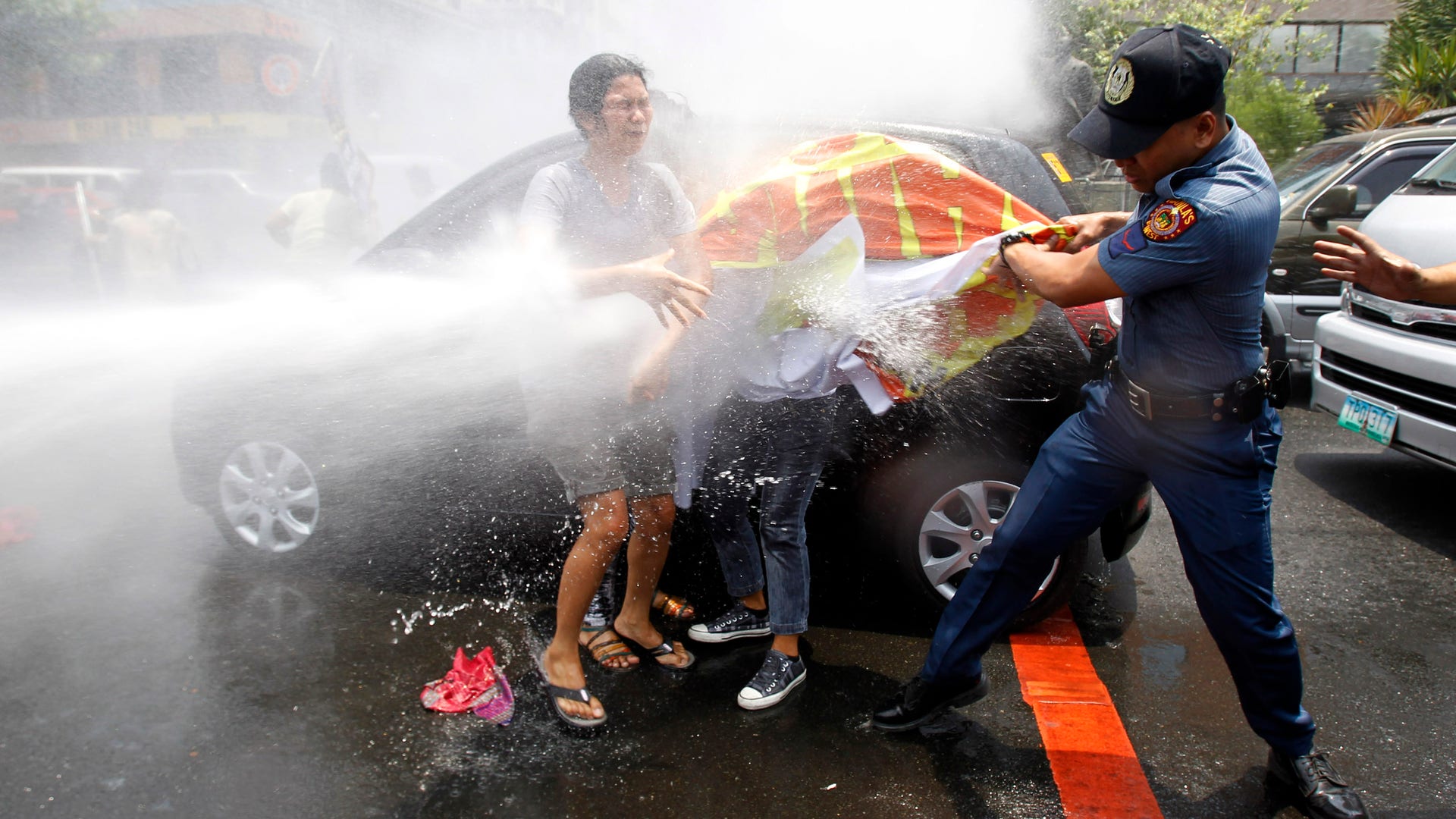Activists protest President obama visit 