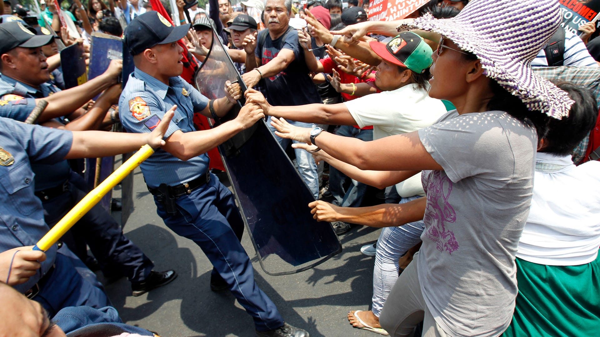 Activists protest President obama visit 