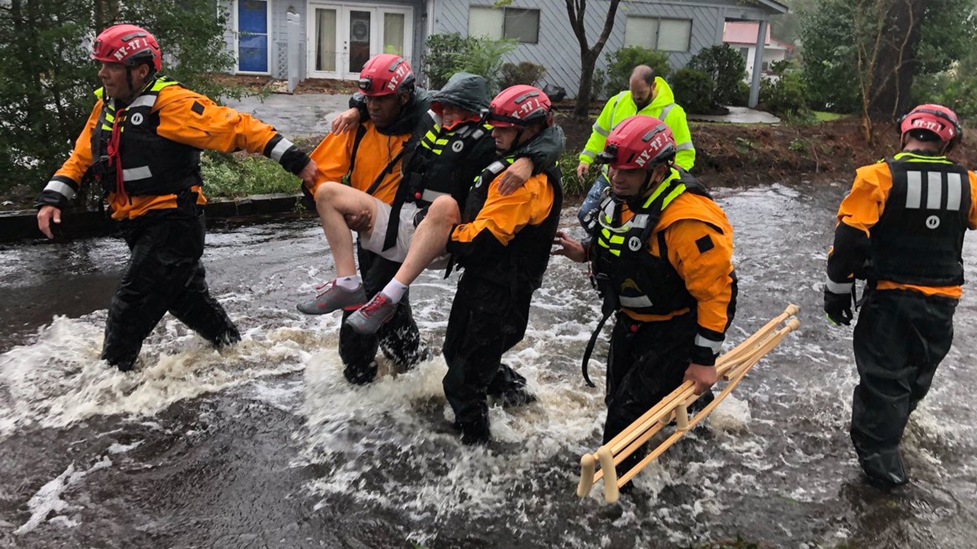 Search and Rescue workers from New York rescue a man in River Bend, North Carolina, Friday