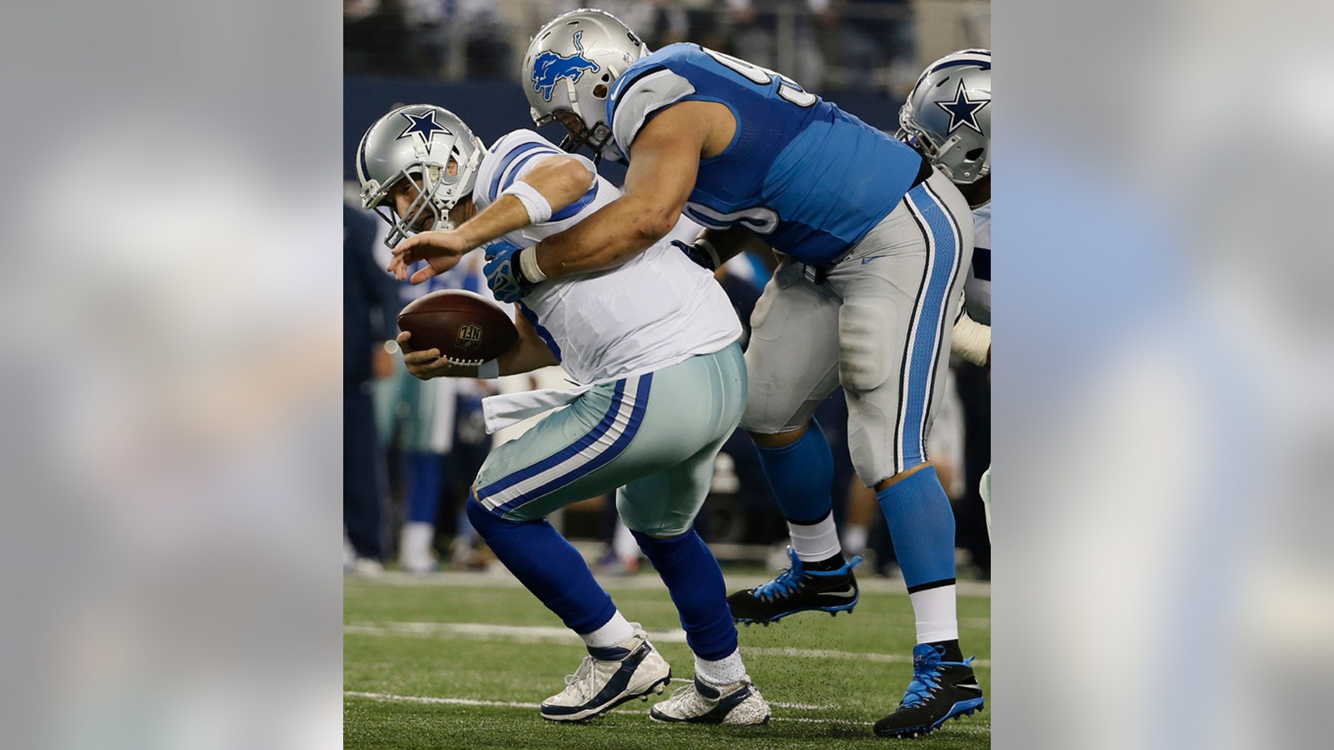 Detroit Lions defensive tackle Ndamukong Suh (90) sacks Dallas Cowboys quarterback Tony Romo (9)