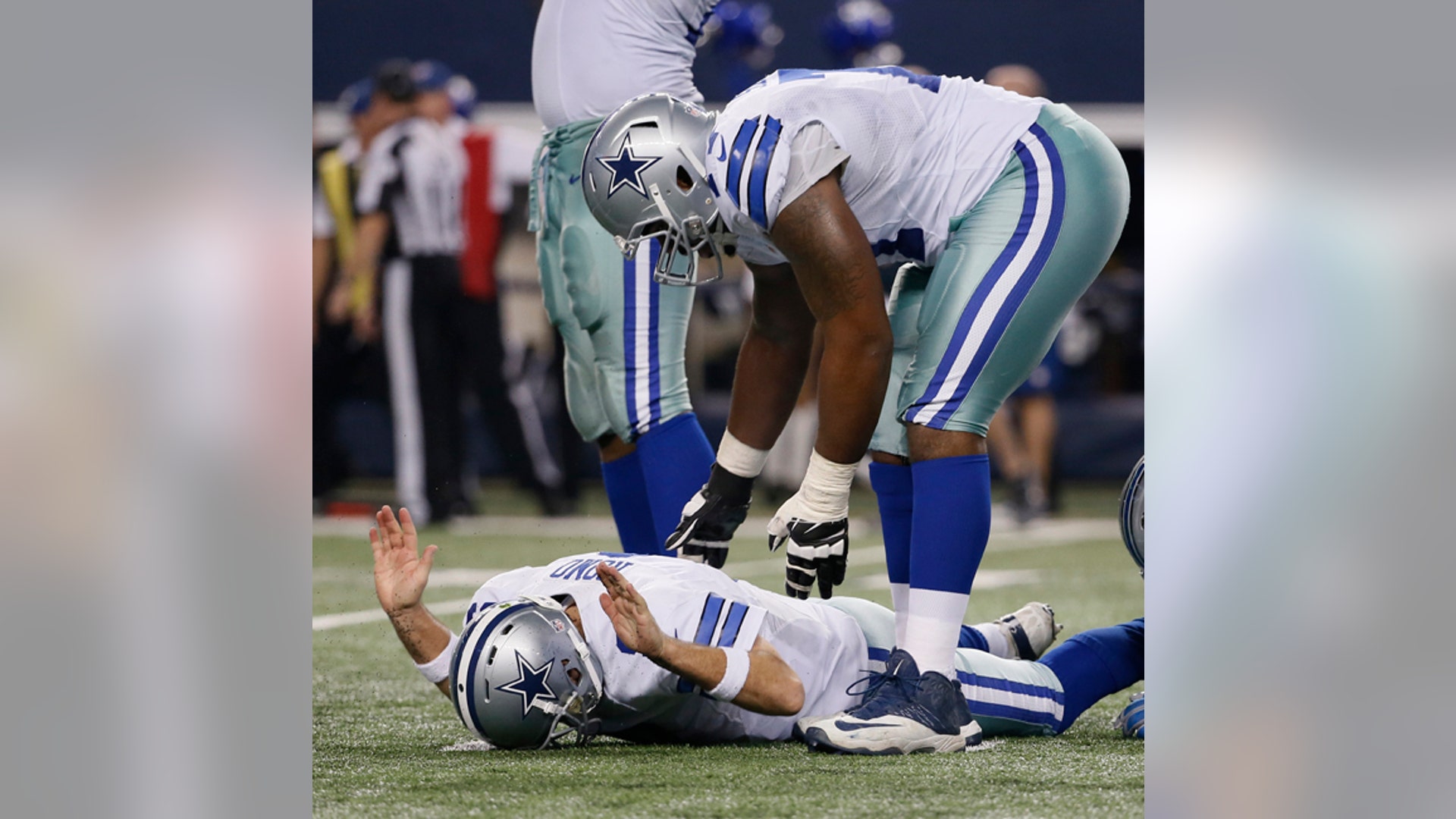 Dallas Cowboys quarterback Tony Romo (9) celebrates a touchdown against the Detroit Lions
