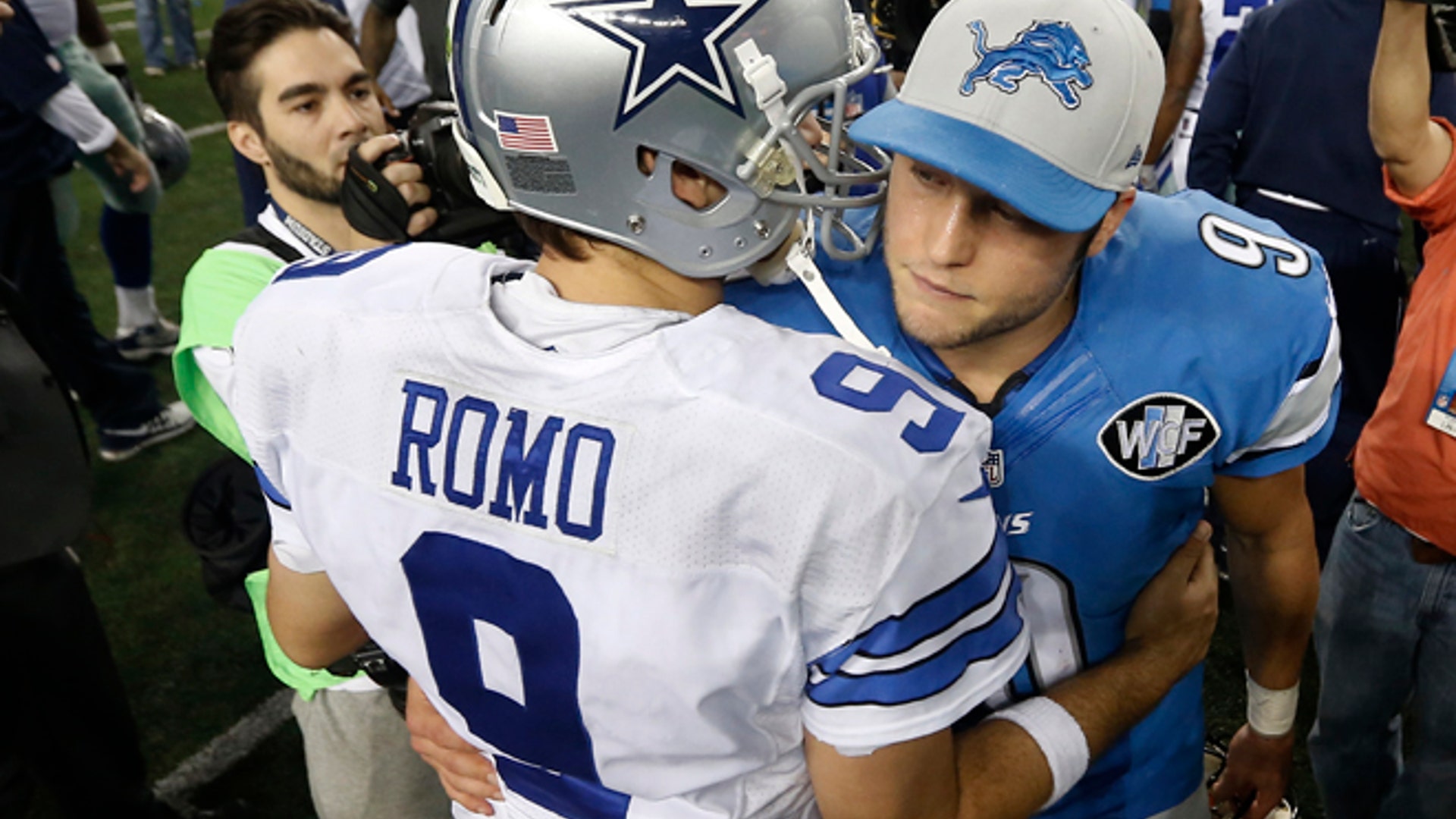 Dallas Cowboys quarterback Tony Romo and Detroit Lions quarterback Matthew Stafford greet after the game 