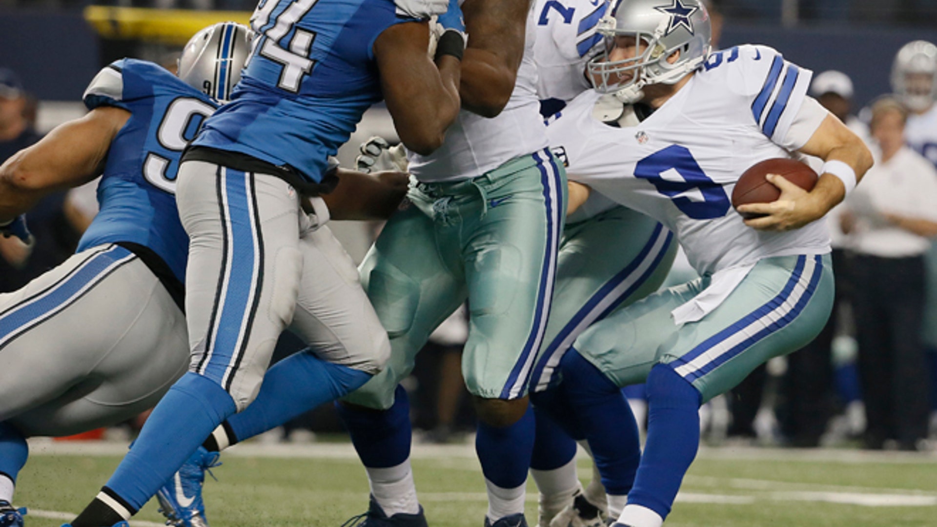 Detroit Lions defensive tackle Ndamukong Suh (90) sacks Dallas Cowboys quarterback Tony Romo (9) 