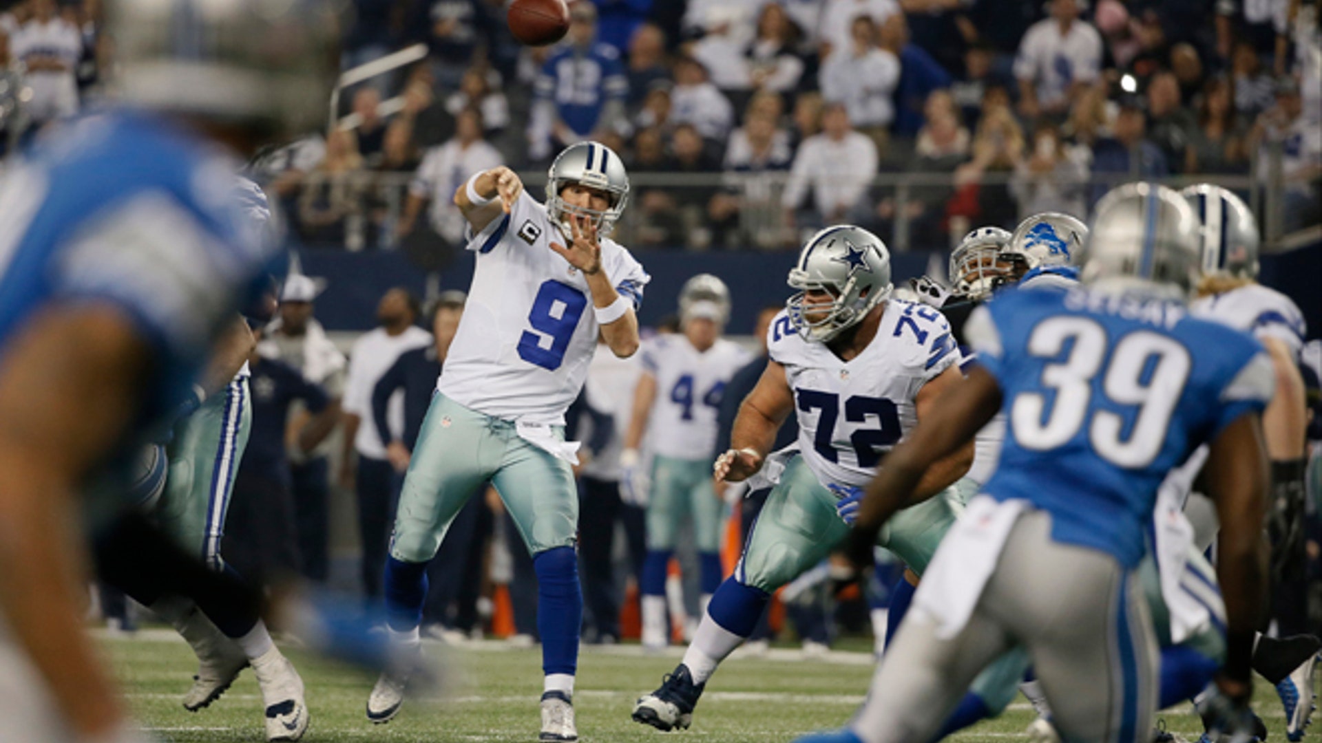 Tony Romo (9) throws a pass during the second half of an NFL wildcard playoff football game against the Detroit Lions