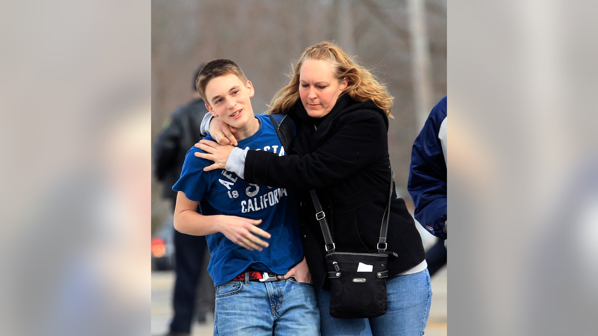 School_Shooting_Vertical_Photo_Hugging_Son