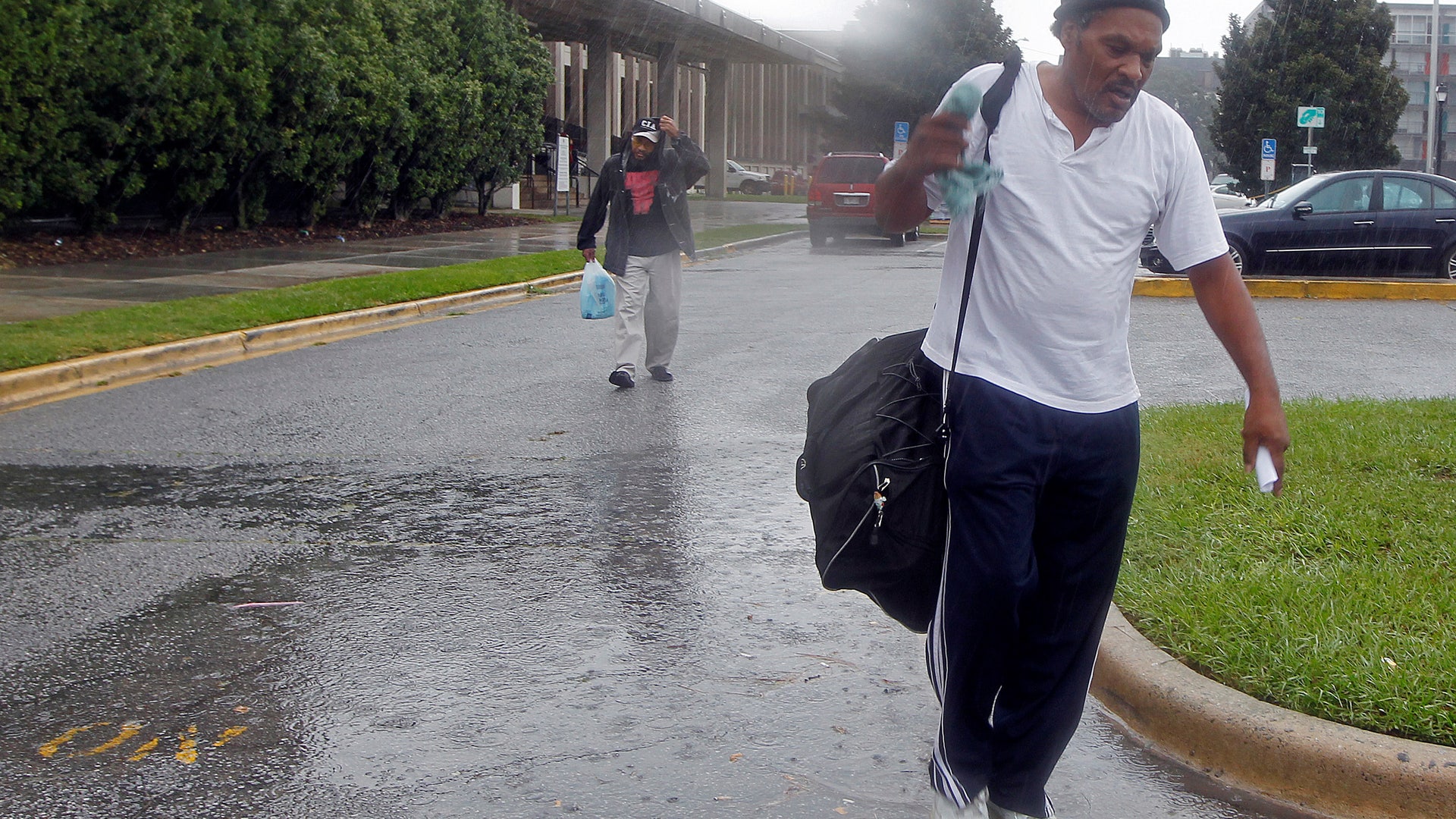 Evacuees leave storm's path