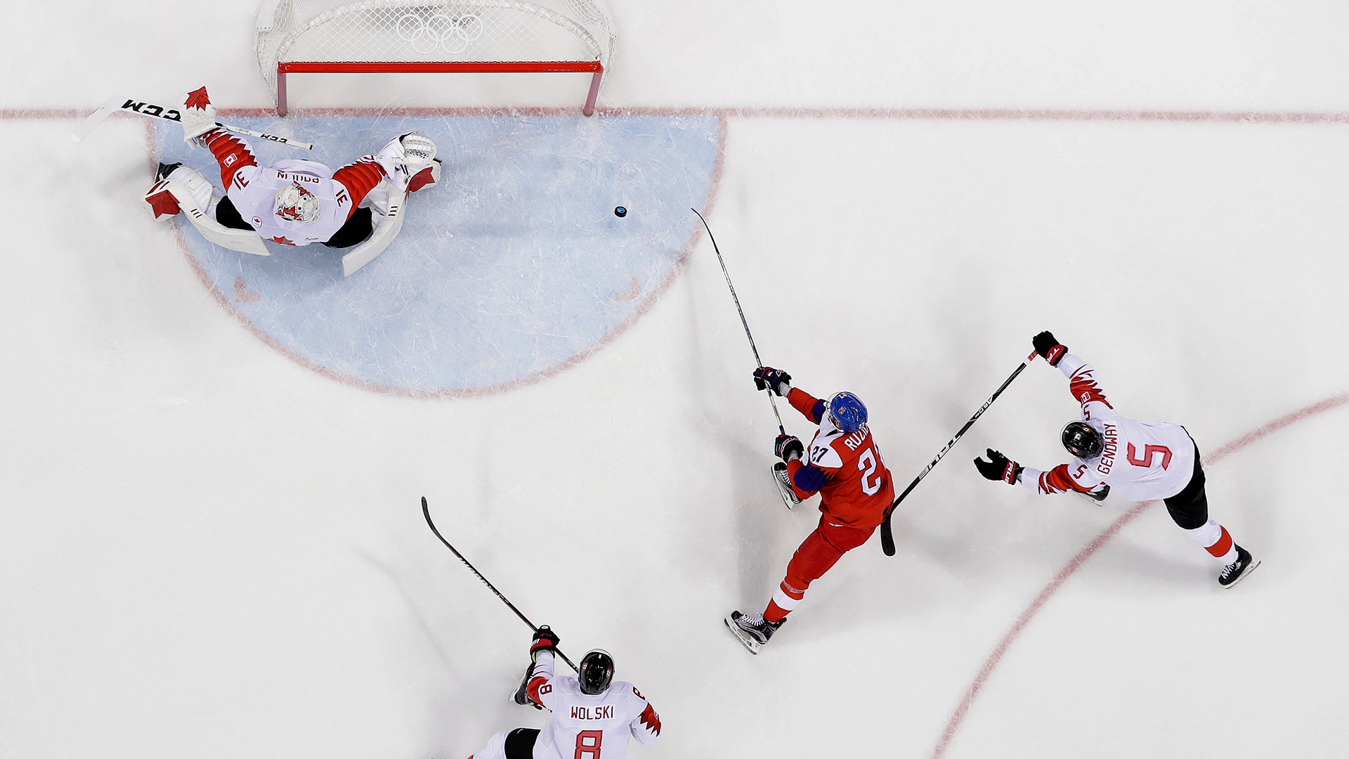 Martin Ruzicka of the Czech Republic shoots the puck past goalie Kevin Poulin of Canada