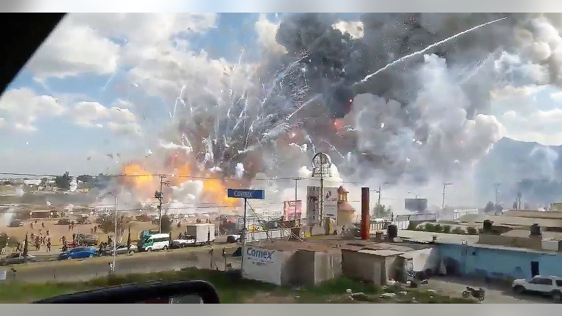 A video camera in a passing care recorded an explosion ripping through the San Pablito fireworks' market in Tultepec, Mexico, on Tuesday, Dec. 20, 2016, leaving at least 26 dead.
