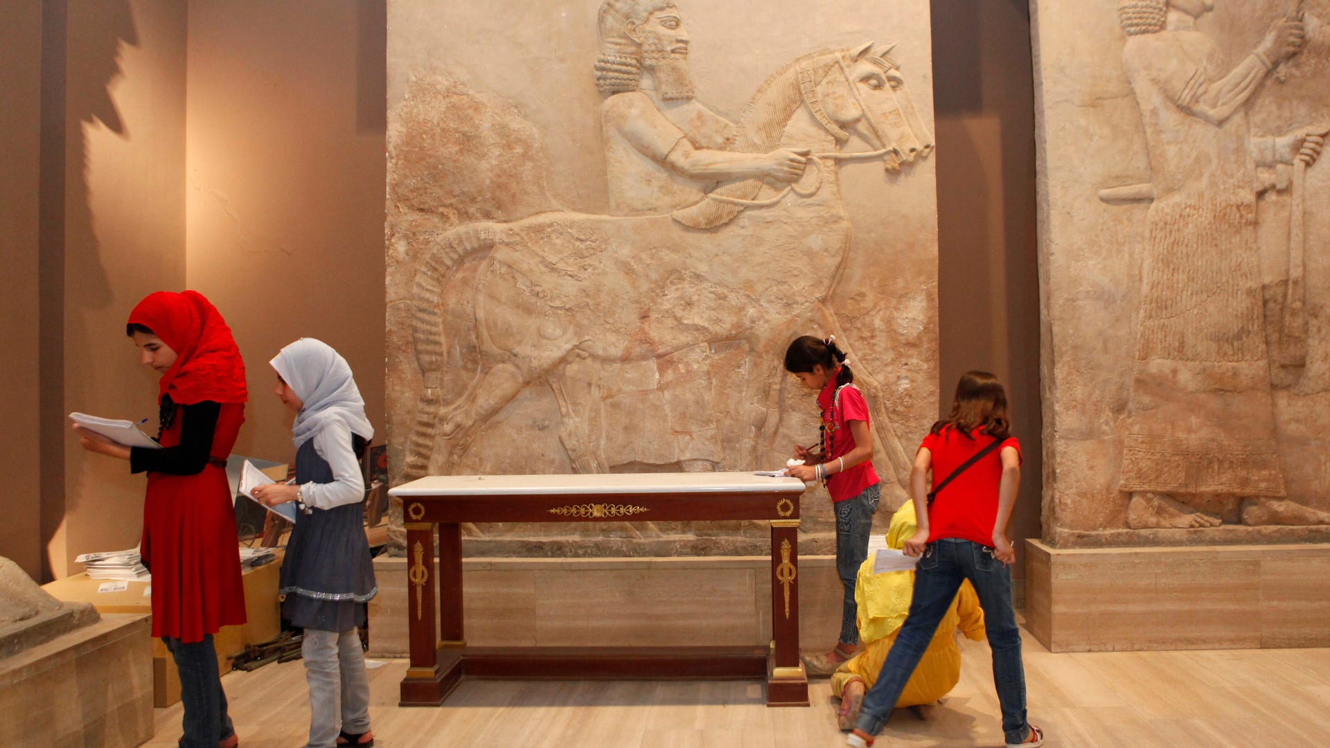 School students visit the restored Iraqi National Museum in Baghdad, Iraq