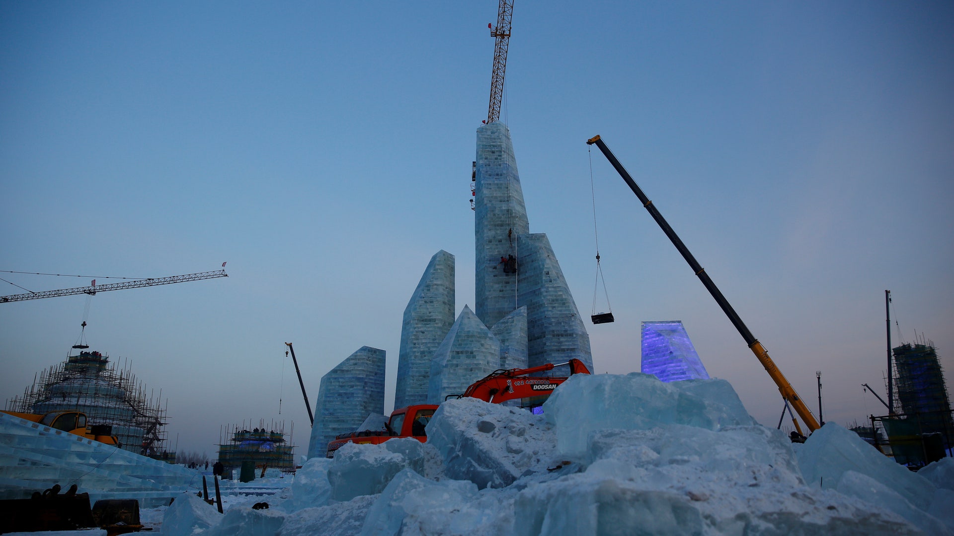 Artists and workers prepare for the Harbin International Ice and Snow Sculpture Festival.