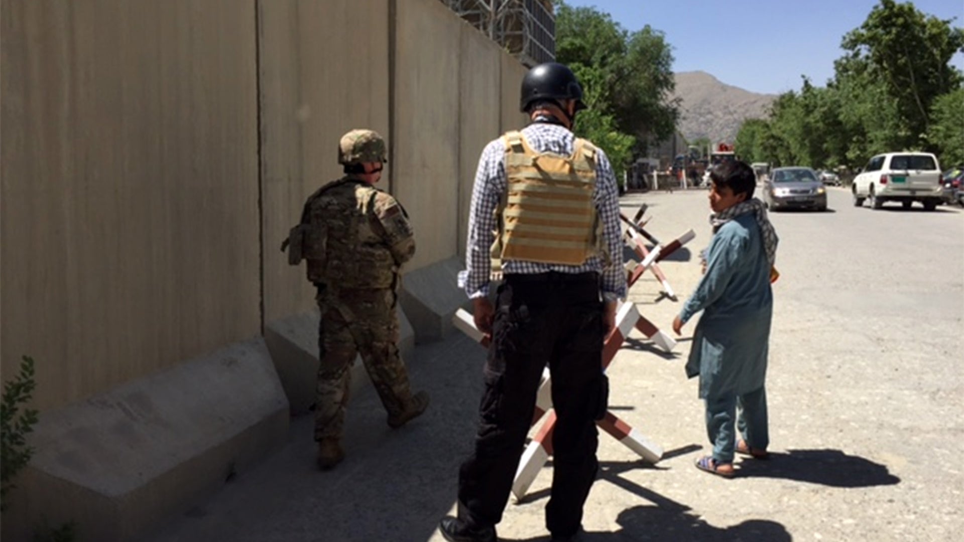 Joseph Homayoon (linguist) with the children on a street in Kabul