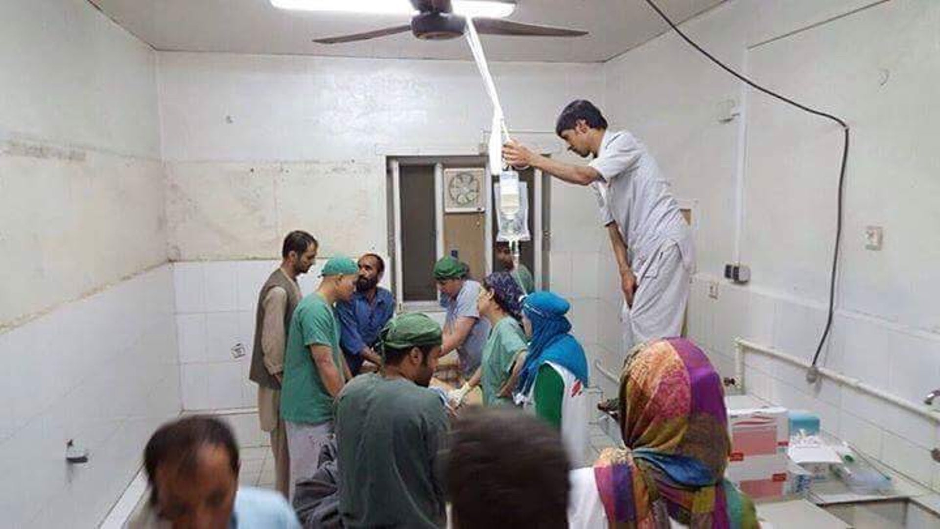 Afghan medical personnel tend to a wounded person