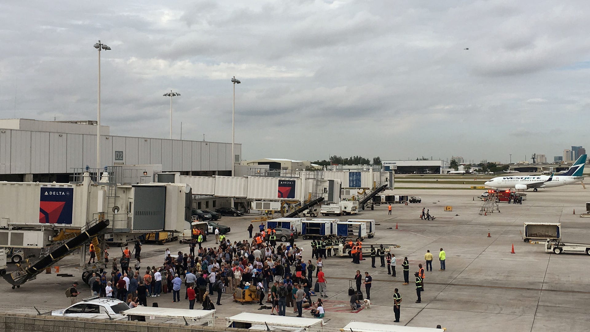 Travelers on the tarmac at Fort Lauderdale-Hollywood International Airport.