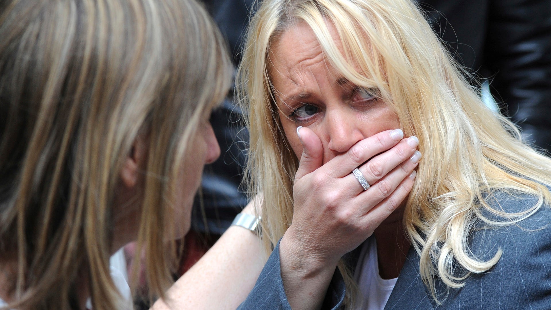 A woman reacts as police evacuate the Arndale shopping centre, in Manchester, England hours after the Manchester terror attack.
