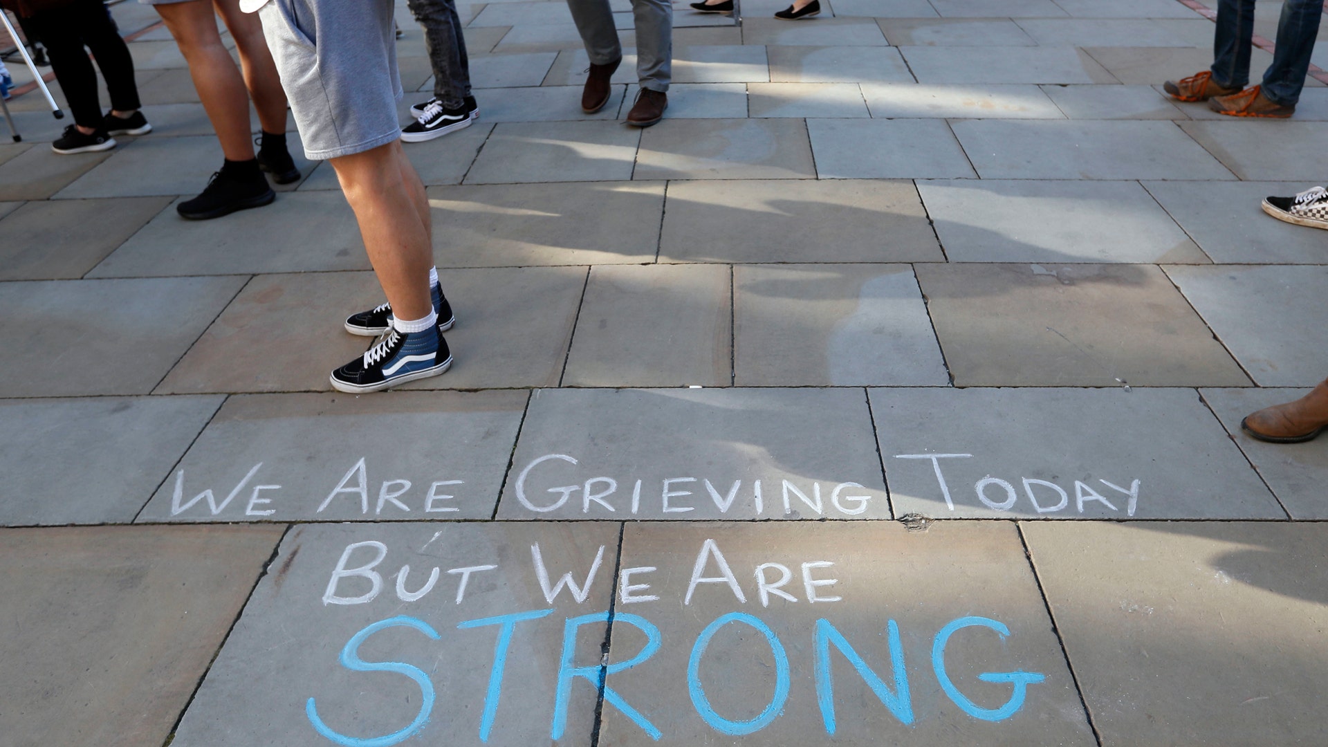A message is written on the pavement in Manchester, England, Tuesday May 23, 2017
