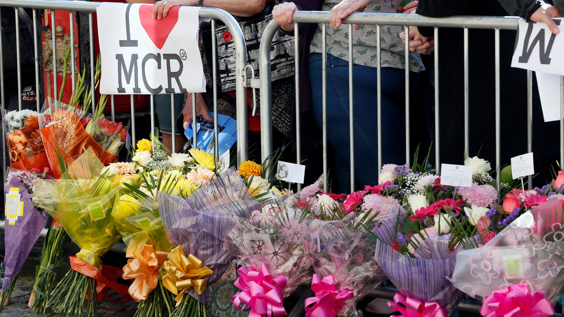 People attend a vigil in Albert Square, Manchester, England, May 23, 2017 