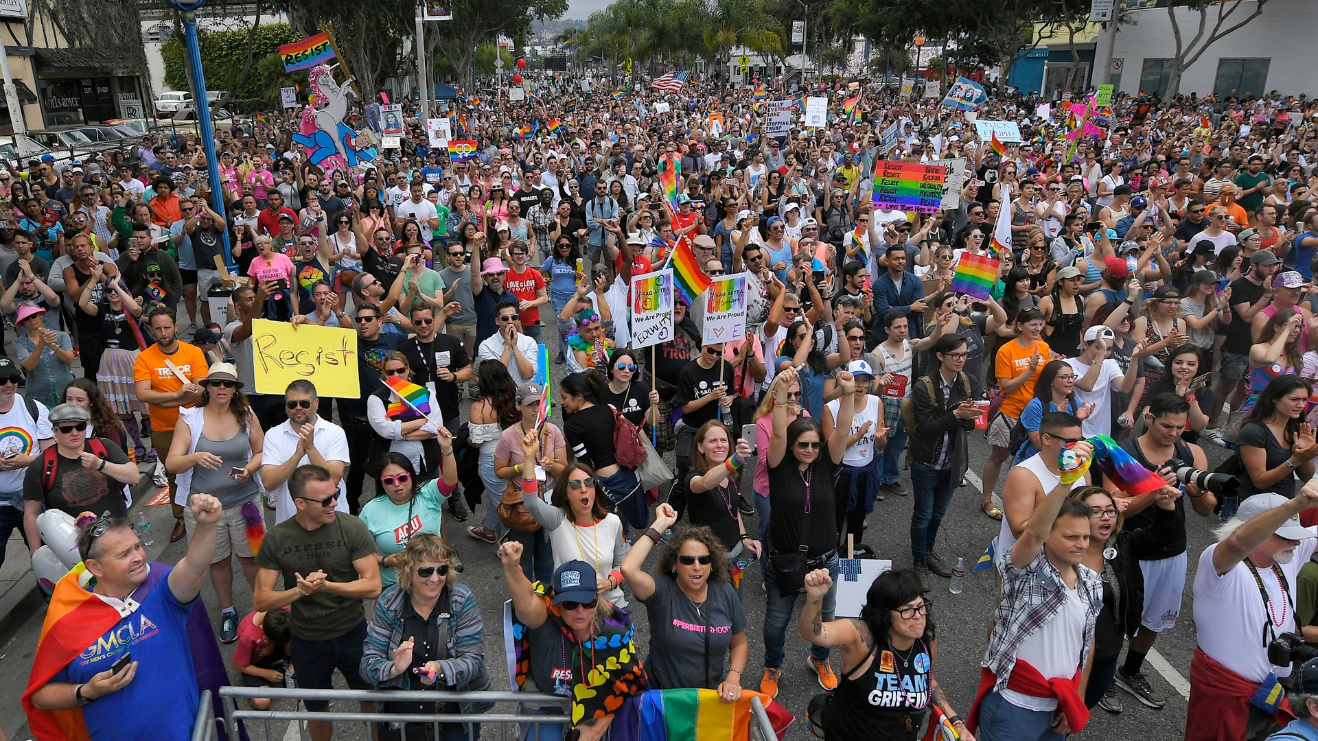 Marchers gather to hear speakers at the end of the Los Angeles LGBTQ #ResistMarch, in West Hollywood, California