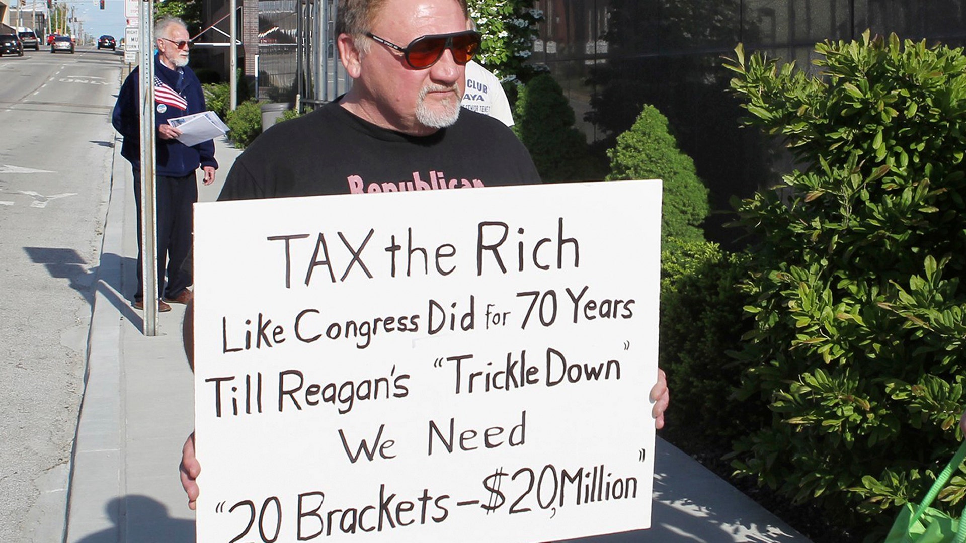 Suspect James T. Hodgkinson protests outside of the United States Post Office in Downtown Belleville, Ill., April 17, 2012