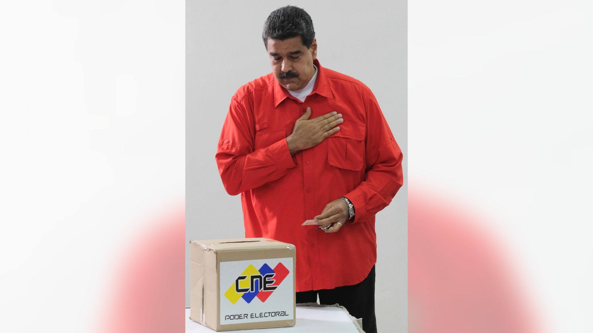President Nicolas Maduro gestures after he casts his ballot as he votes for a constitutional assembly in Caracas, Venezuela